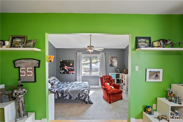 carpeted bedroom featuring ceiling fan