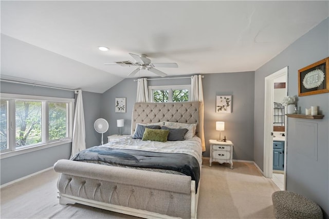 carpeted bedroom featuring ceiling fan, vaulted ceiling, and multiple windows