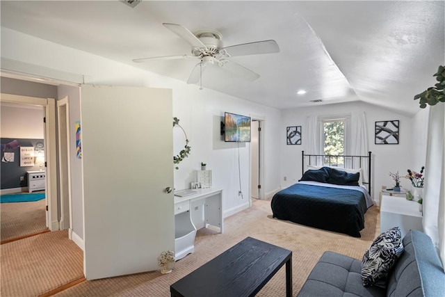 bedroom with ceiling fan, light colored carpet, and lofted ceiling