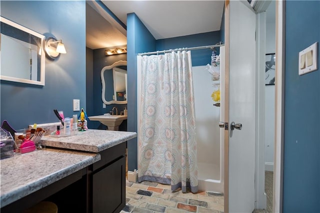 bathroom featuring sink and walk in shower