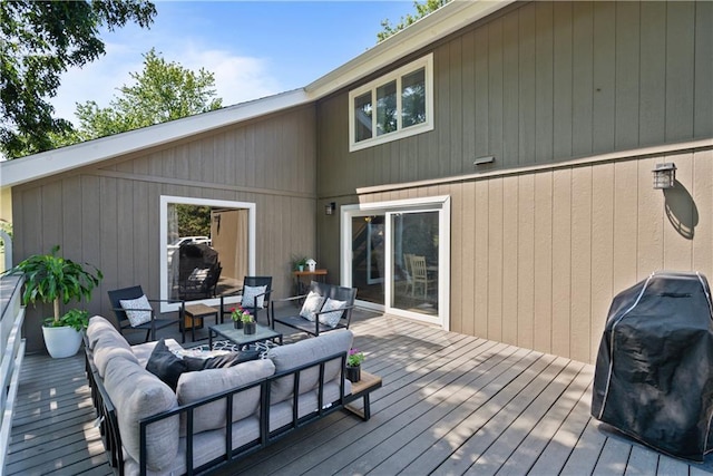 deck with outdoor lounge area and grilling area