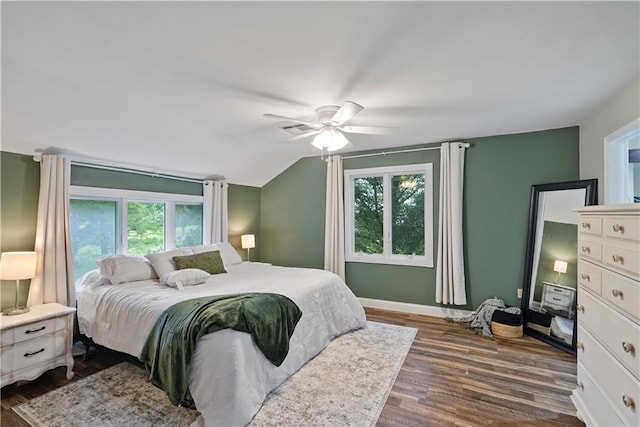2924 Crown Dr, Independence, KS 67301 - bedroom featuring multiple windows, dark wood-style floors, lofted ceiling, and a ceiling fan
