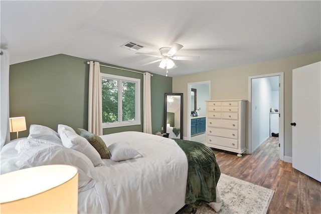 2924 Crown Dr, Independence, KS 67301 - bedroom with dark wood-type flooring, lofted ceiling, connected bathroom, and a ceiling fan