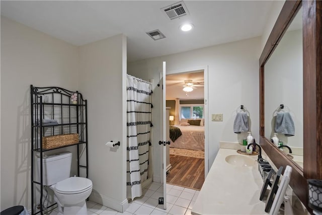 2924 Crown Dr, Independence, KS 67301 - ensuite bathroom featuring tile patterned floors, vanity, curtained shower, and ceiling fan