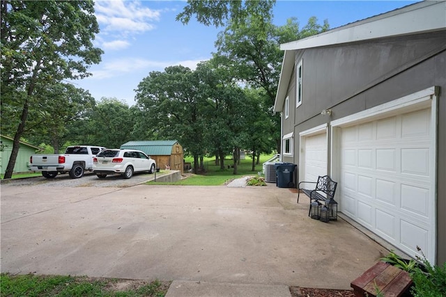 2924 Crown Dr, Independence, KS 67301 - view of parking featuring concrete driveway and an attached garage