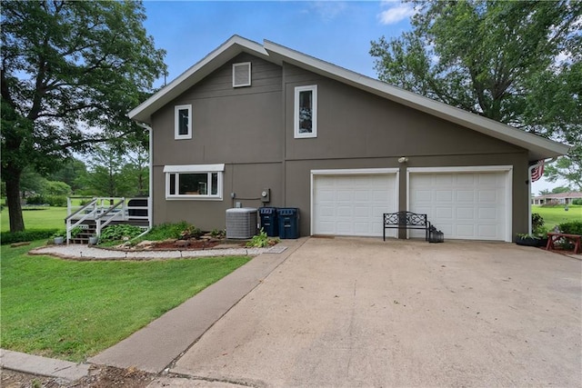 2924 Crown Dr, Independence, KS 67301 - view of side of home with a lawn, concrete driveway, and a wooden deck