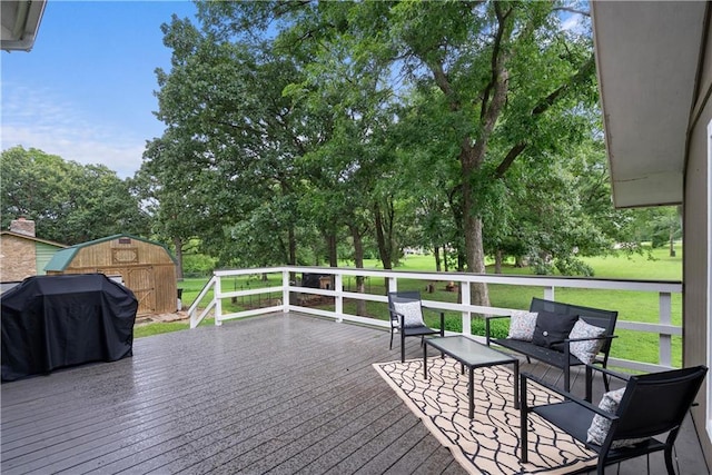 2924 Crown Dr, Independence, KS 67301 - deck featuring a storage shed, a yard, outdoor lounge area, grilling area, and view of scattered trees