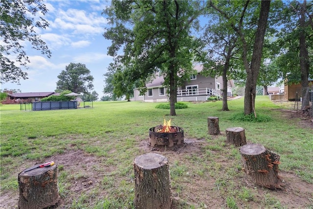 2924 Crown Dr, Independence, KS 67301 - view of green lawn with a fire pit