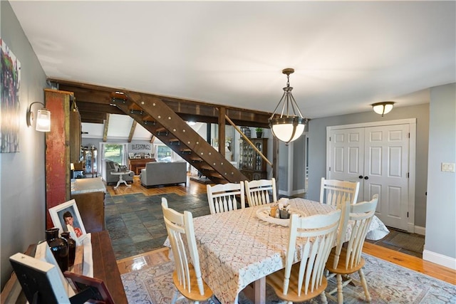 2924 Crown Dr, Independence, KS 67301 - dining area with stairway and wood finished floors