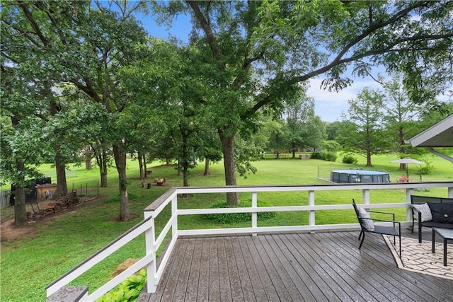 2924 Crown Dr, Independence, KS 67301 - deck featuring a yard and view of wooded area