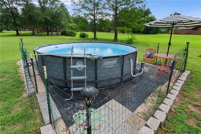 2924 Crown Dr, Independence, KS 67301 - view of swimming pool featuring a lawn