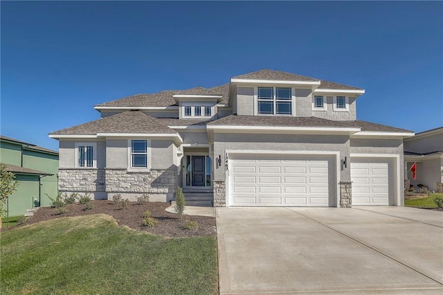 prairie-style home featuring a front yard, stone siding, concrete driveway, and stucco siding