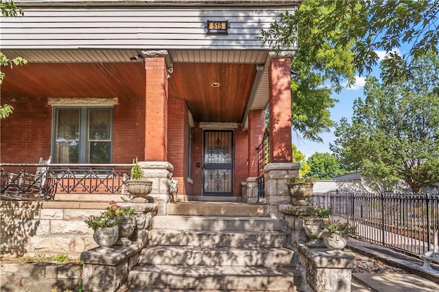 entrance to property featuring a porch