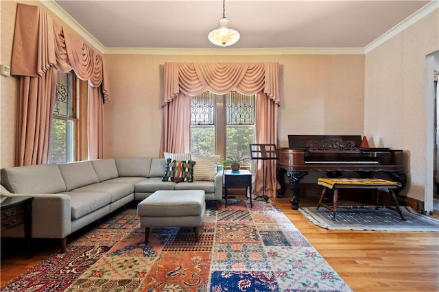 living room with ornamental molding, wood-type flooring, and a wealth of natural light