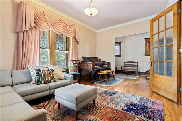 living room with light hardwood / wood-style floors and ornamental molding