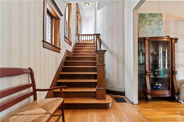 stairs with wood-type flooring