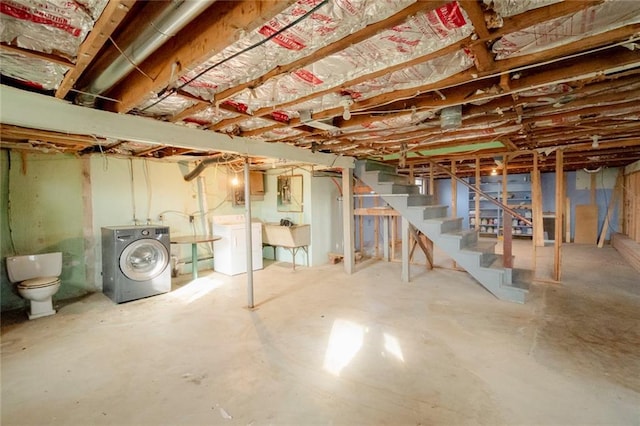 basement with independent washer and dryer and sink