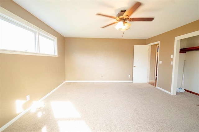 unfurnished bedroom with carpet, a closet, and ceiling fan