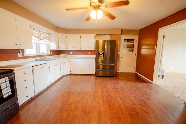 kitchen featuring white cabinets, sink, ceiling fan, light hardwood / wood-style floors, and stainless steel appliances