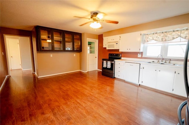 kitchen with white appliances, ceiling fan, sink, light hardwood / wood-style floors, and white cabinetry