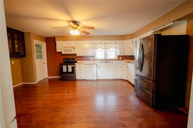 kitchen featuring white cabinets, ceiling fan, dark hardwood / wood-style flooring, and stainless steel appliances