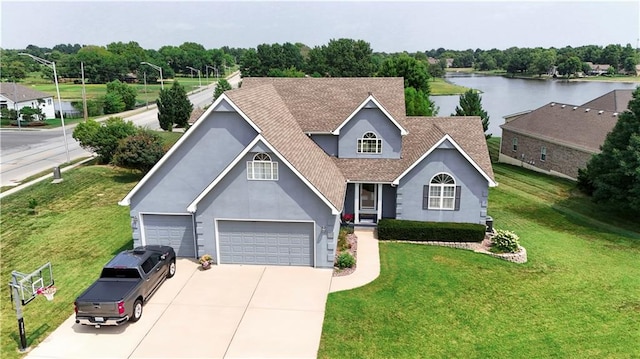 view of front of property featuring a front lawn and a water view