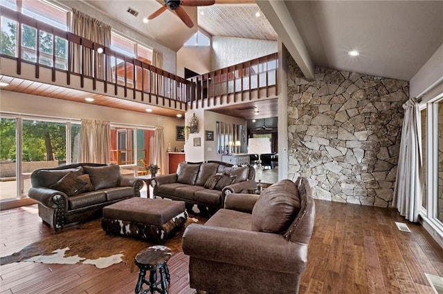 living room with high vaulted ceiling, dark wood-type flooring, beamed ceiling, and ceiling fan