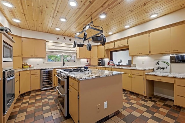 kitchen featuring appliances with stainless steel finishes, beverage cooler, dark tile patterned flooring, and wooden ceiling