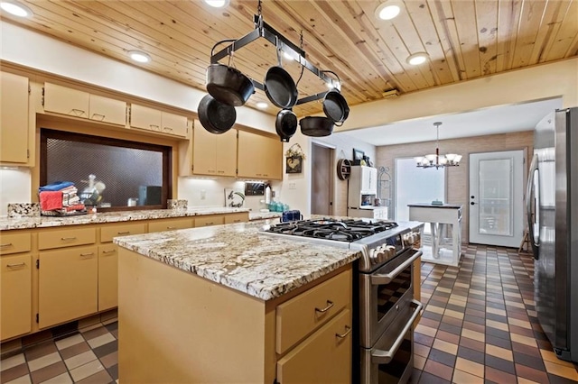 kitchen featuring a kitchen island, appliances with stainless steel finishes, dark tile patterned flooring, and wooden ceiling