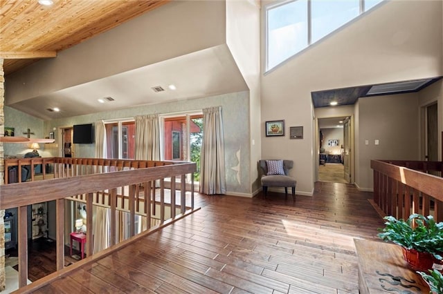 hallway featuring wood-type flooring and wooden ceiling