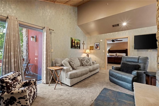 carpeted living room with ceiling fan, high vaulted ceiling, and wood ceiling