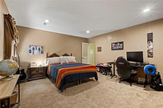 carpeted bedroom featuring a textured ceiling