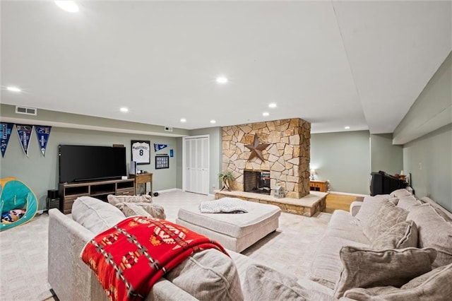 carpeted living room with a fireplace