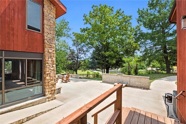 wooden deck with a patio