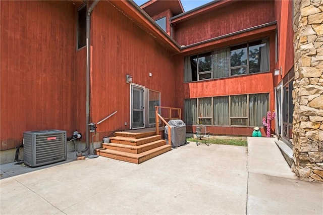 entrance to property featuring central AC and a patio area