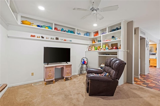 interior space with light tile patterned flooring and ceiling fan