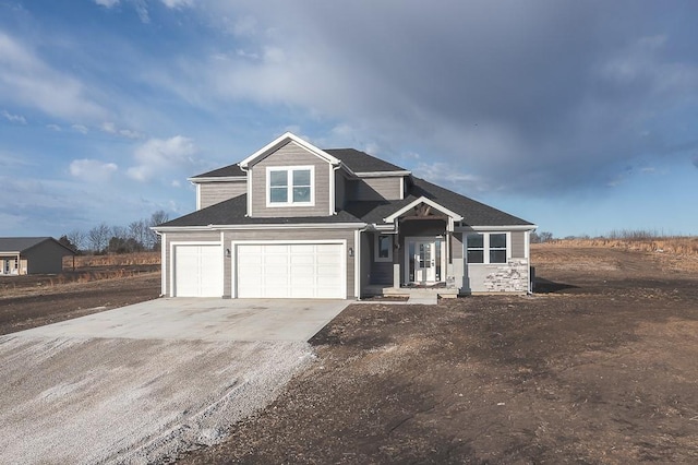 view of front of home featuring a garage and concrete driveway