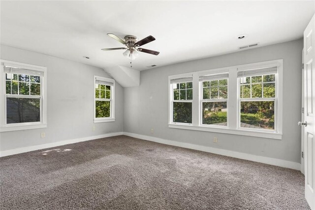 spare room featuring carpet and ceiling fan