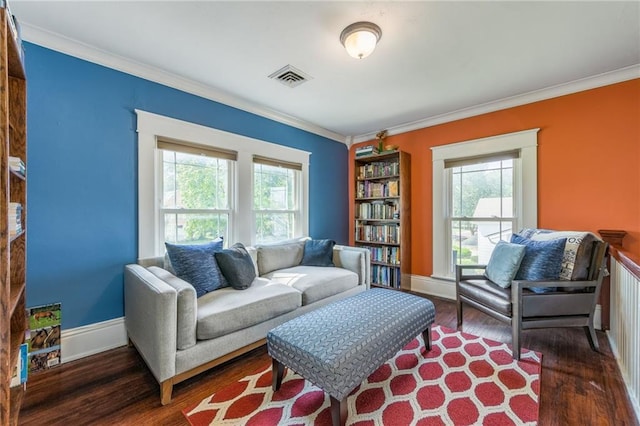 sitting room with dark hardwood / wood-style flooring and ornamental molding