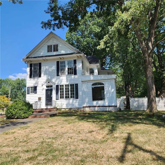 neoclassical / greek revival house with a front yard