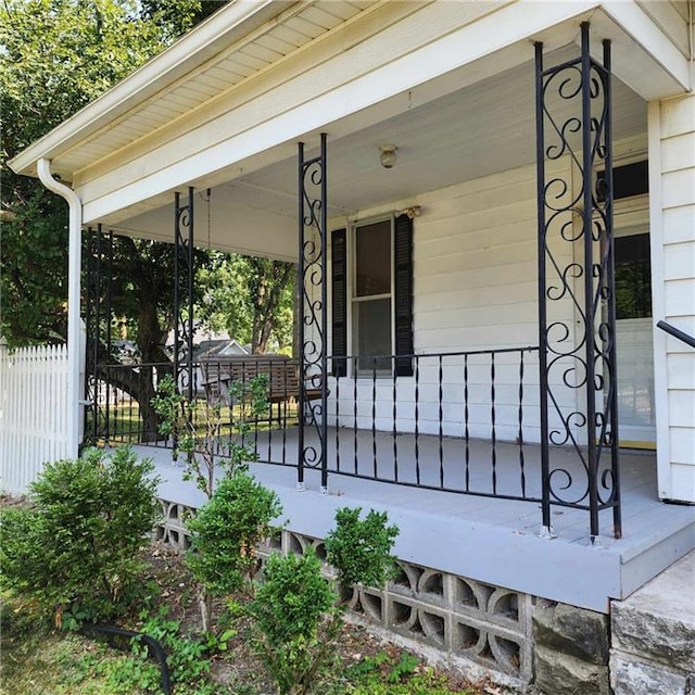 view of exterior entry featuring a porch