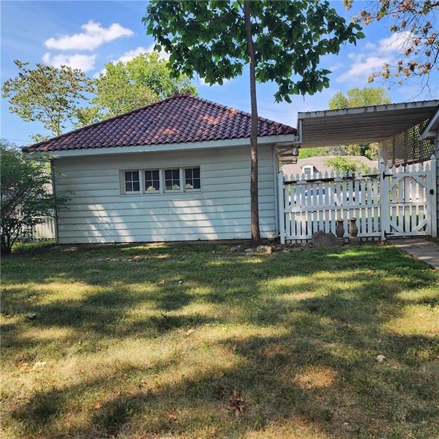 view of home's exterior featuring a yard