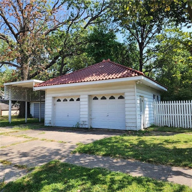 garage featuring a carport