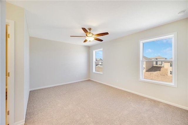 7004 NE 102nd Ct, Kansas City, MO 64156 - carpeted empty room featuring ceiling fan and baseboards
