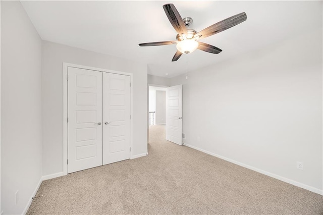 7004 NE 102nd Ct, Kansas City, MO 64156 - unfurnished bedroom with light colored carpet, a closet, and ceiling fan