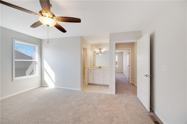 7004 NE 102nd Ct, Kansas City, MO 64156 - spare room with light colored carpet and ceiling fan