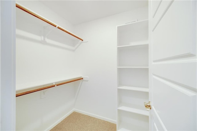 7004 NE 102nd Ct, Kansas City, MO 64156 - spacious closet featuring carpet floors