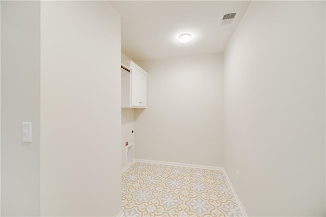 7004 NE 102nd Ct, Kansas City, MO 64156 - washroom featuring cabinet space and electric dryer hookup