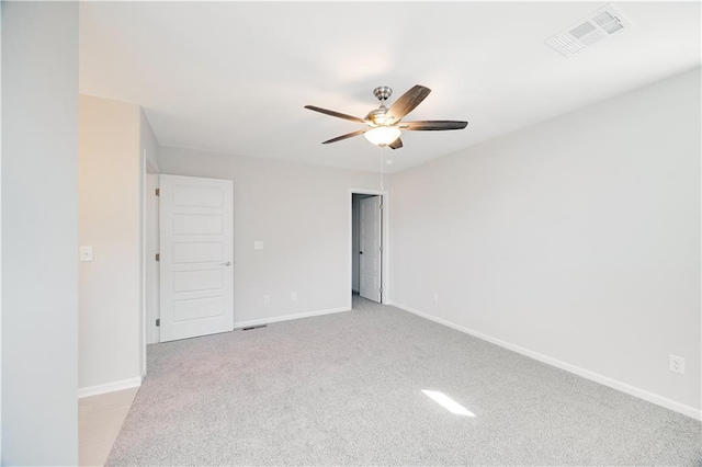 7004 NE 102nd Ct, Kansas City, MO 64156 - spare room with a ceiling fan and light carpet
