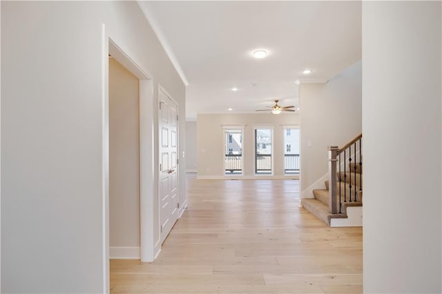 7004 NE 102nd Ct, Kansas City, MO 64156 - corridor with crown molding, stairway, light wood-style floors, and recessed lighting